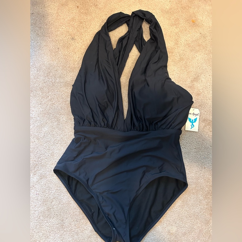 Amethyst brand one piece swimsuit with tag still attached.